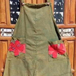 green dungarees/red flower